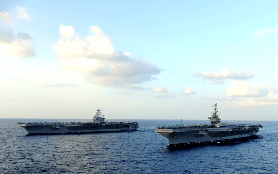 US Navy 120119-N-QH883-187 The Nimitz-class aircraft carriers USS Abraham Lincoln (CVN 72) and USS John C. Stennis (CVN 74) join for a turnover of