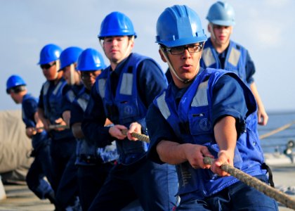 US Navy 120119-N-ZF681-161 Sailors aboard the guided-missile destroyer USS Halsey (DDG 97) heave a fuel line