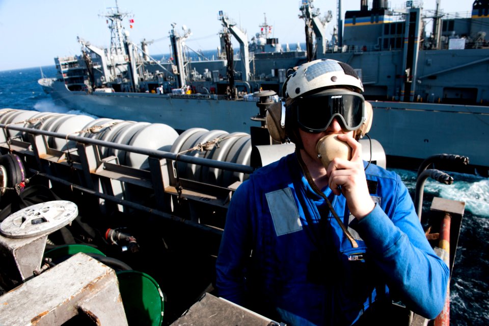 US Navy 120116-N-OY799-307 Aviation Boatswain's Mate (Handling) Airman Kevin Ward mans a elevator operator during a replenishment at sea aboard the