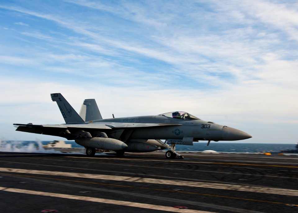 US Navy 120121-N-FI736-165 An F-A-18F Super Hornet assigned to the Thunderbolts of Strike Fighter Squadron (VFA) 136, takes off from the flight dec