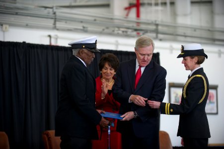 US Navy 120117-N-AC887-731 Secretary of the Navy (SECNAV) the honorable Ray Mabus prepares to pin the Navy and Marine Corps Commendation medal with