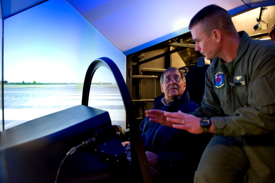 US Navy 120120-D-BW835-003 Secretary of Defense Leon E. Panetta is shown the Joint Strike Fighter Manned Flight Simulator