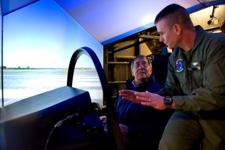 US Navy 120120-D-BW835-003 Secretary of Defense Leon E. Panetta is shown the Joint Strike Fighter Manned Flight Simulator