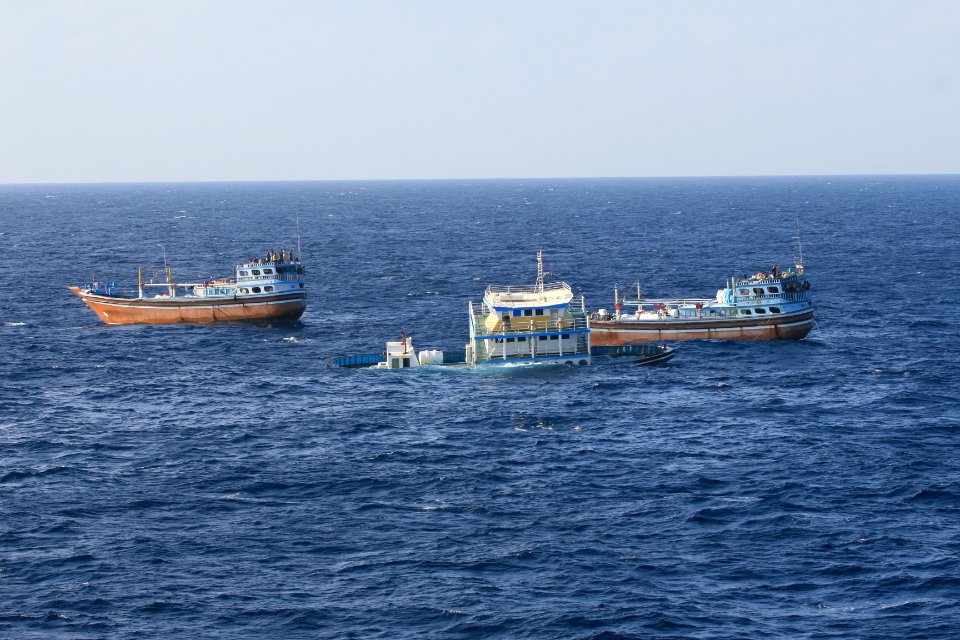 US Navy 120118-N-ZZ999-003 Two Iranian dhows continue their voyage after the guided-missile destroyer USS Dewey (DDG 105), assigned to Commander, T