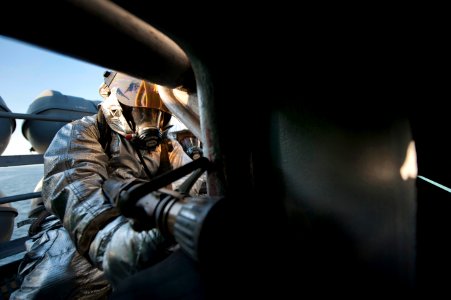 US Navy 120120-N-DR144-457 A Sailor in a hot suit fights a simulated fire
