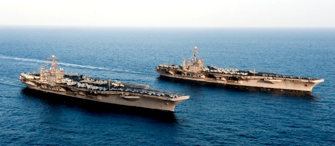 US Navy 120119-N-OY799-174 The Nimitz-class aircraft carriers USS John C. Stennis (CVN 74) and USS Abraham Lincoln (CVN 72) transit during a turnov