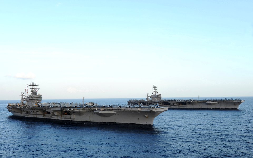 US Navy 120119-N-QH883-191 The Nimitz-class aircraft carriers USS Abraham Lincoln (CVN 72) and USS John C. Stennis (CVN 74) join for a turnover of