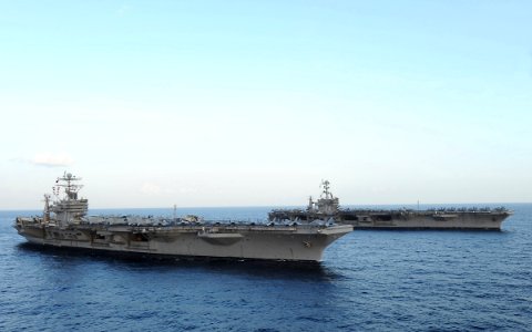 US Navy 120119-N-QH883-191 The Nimitz-class aircraft carriers USS Abraham Lincoln (CVN 72) and USS John C. Stennis (CVN 74) join for a turnover of