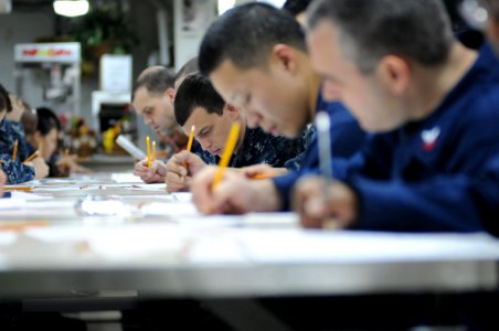 US Navy 120119-N-GZ832-012 First class petty officers aboard the Nimitz-class aircraft carrier USS Carl Vinson (CVN 70) take the chief petty office
