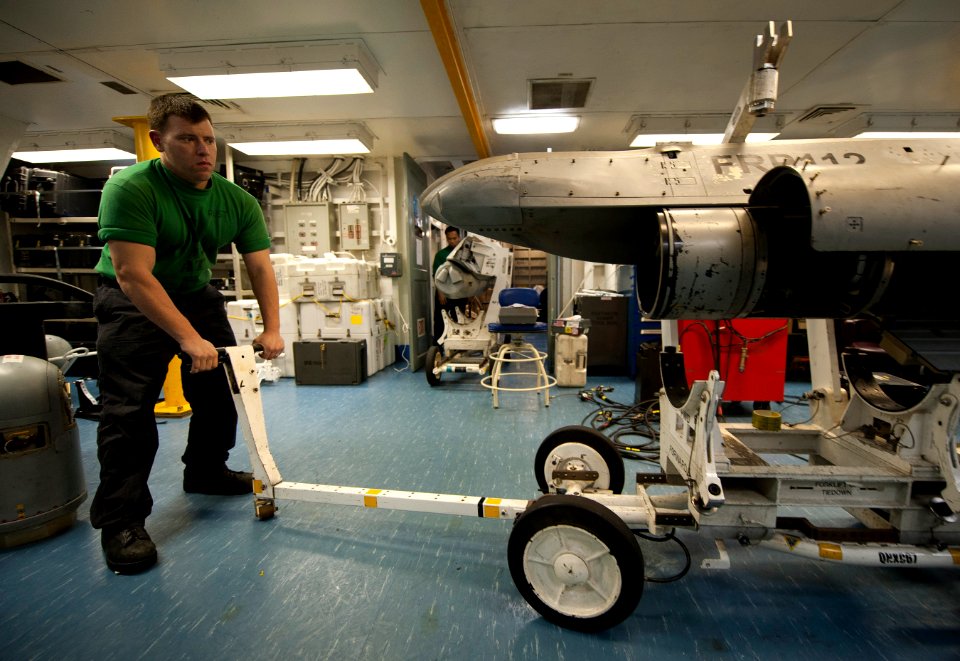 US Navy 120123-N-DR144-529 Aviation Electronics Technician 3rd Class Paul Rust positions an advanced targeting forward looking infrared (ATFLIR) po