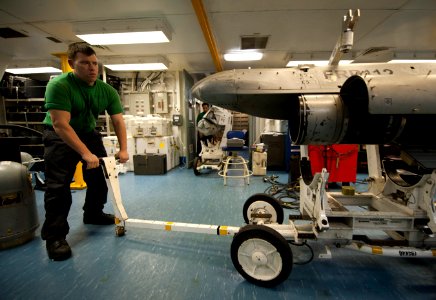 US Navy 120123-N-DR144-529 Aviation Electronics Technician 3rd Class Paul Rust positions an advanced targeting forward looking infrared (ATFLIR) po