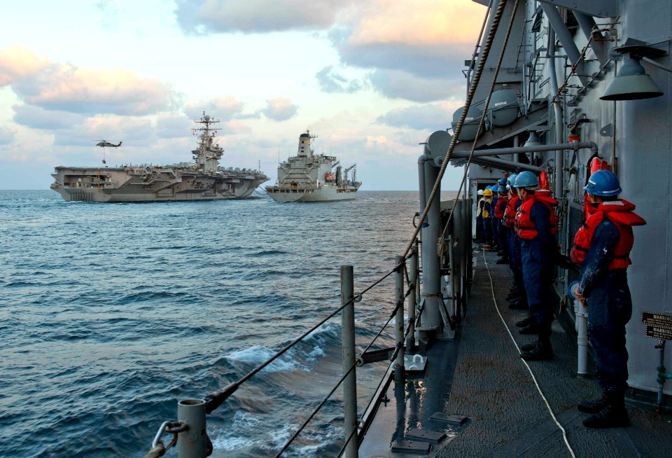 US Navy 120121-N-VY256-012 Sailors aboard the Ticonderoga-class guided-missile cruiser USS Cape St. George (CG 71) watch the Military Sealift Comma