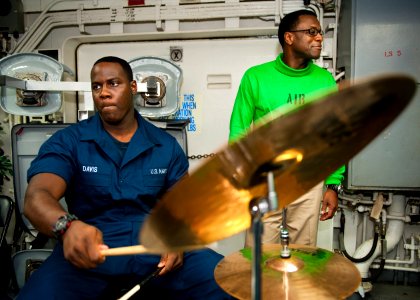 US Navy 120123-N-FI736-178 Personnel Specialist Seaman Dwayne Davis plays the drums during a Dr. Martin Luther King, Jr. birthday celebration aboar