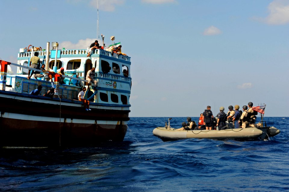 US Navy 120118-N-VH839-091 A rigid hull inflatable boat with Sailors from the guided-missile destroyer USS Dewey's (DDG 105) visit, board, search a