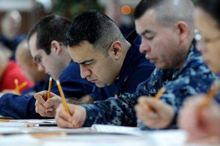 US Navy 120119-N-GZ832-003 Damage Controlman 1st Class Steven Espinoza takes the chief petty officer exam aboard the Nimitz-class aircraft carrier
