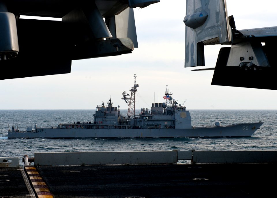 US Navy 120121-N-FI736-208 The Ticonderoga-class guided-missile cruiser USS Normandy (CG 60) is underway with the aircraft carrier USS Enterprise (