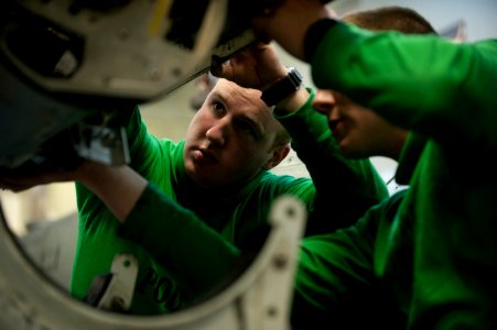 US Navy 120123-N-DR144-368 Aviation Electronics Technician 3rd Class Matthew Murphy, assigned to Aircraft Intermediate Maintenance Department's IM