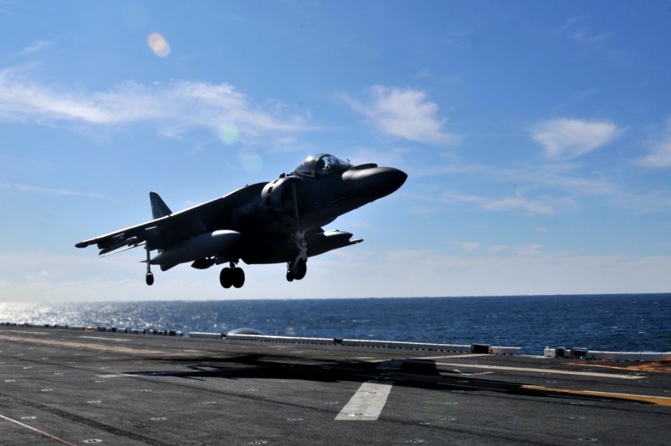 US Navy 120119-N-UM734-260 An AV-8B Harrier from Marine Attack Squadron (VMA) 542 lands on the flight deck of the amphibious assault ship USS Kears