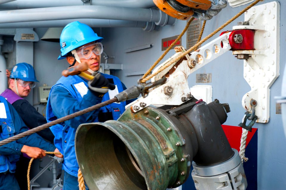 US Navy 120121-N-VY256-141 Seaman Ethan Garcia performs an emergency breakaway during a replenishment at sea aboard the Ticonderoga-class guided-mi