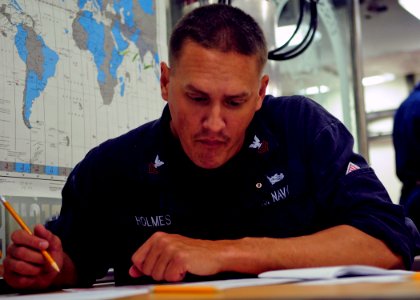 US Navy 120119-N-ZF681-252 Yeoman 1st Class Anna Howeth takes the navy-wide chief petty officer advancement exam aboard the guided-missile destroye