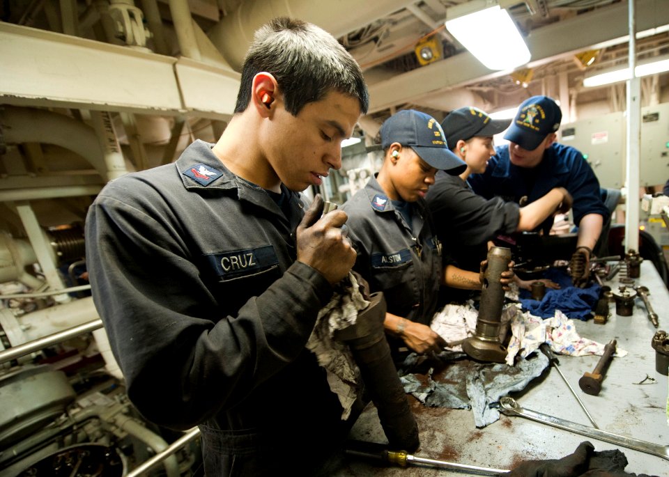US Navy 120124-N-PB383-201 Engineman 2nd Class Richard Cruz and other Sailors assigned the amphibious transport dock ship USS New Orleans (LPD 18)