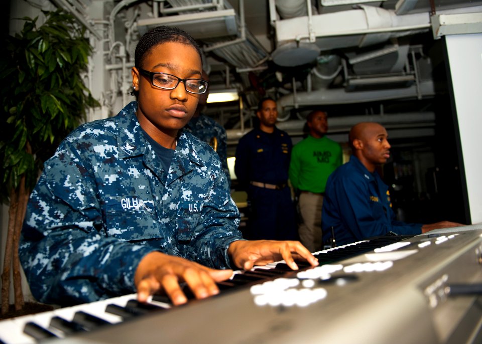 US Navy 120123-N-FI736-131 Information Systems Technician 3rd Class Kentara Gillard plays music during a Dr. Martin Luther King, Jr. birthday celeb