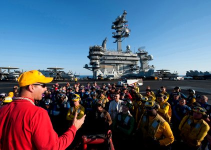 US Navy 120120-N-DR144-104 Air Boatswain Lt. j.g. Alexey Diaz briefs Sailors before a flight deck firefighting drill aboard the Nimitz-class aircra