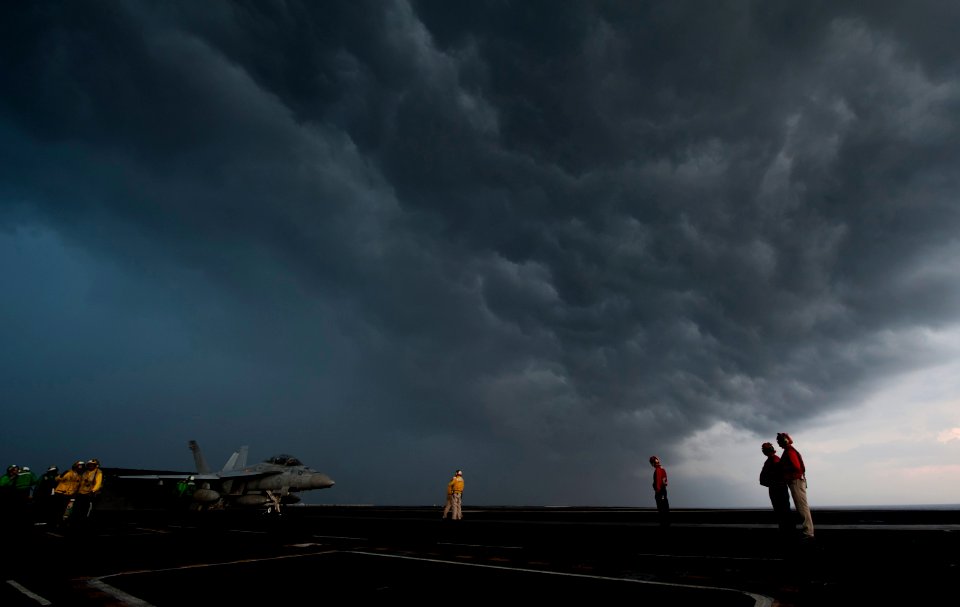 US Navy 120121-N-DR144-012 Sailors prepare an F-A-18F Super Hornet assigned to Strike Fighter Squadron (VFA) 22 for launch on the flight deck