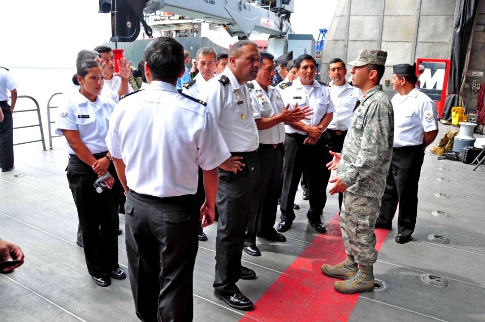 US Navy 120125-A-TF780-064 U.S. Air Force Maj. Ivan Acosta gives a tour briefing to a group of Peruvian navy military policemen from Base Naval De