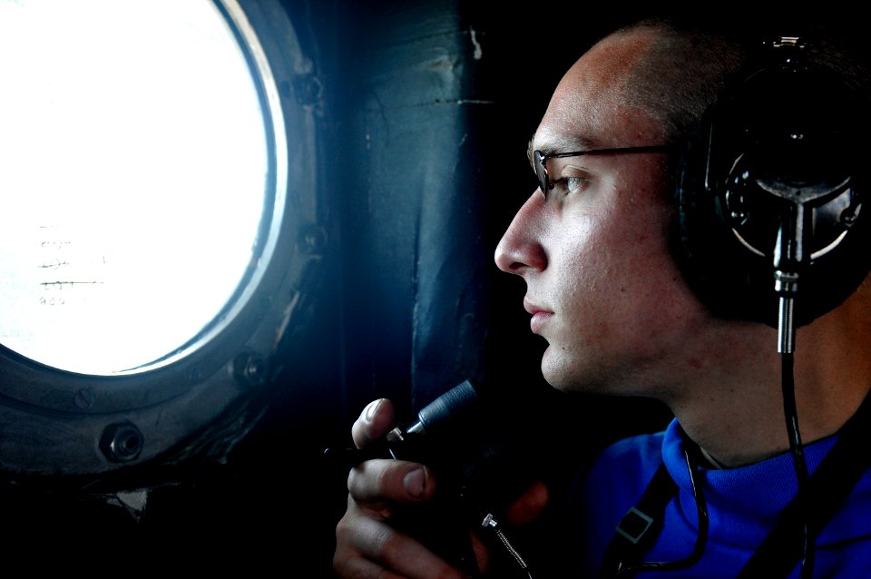 US Navy 120123-N-UT411-090 Airman Apprentice Michael Young, assigned to Air Department's V-1 Division, speaks to Sailors on the flight deck