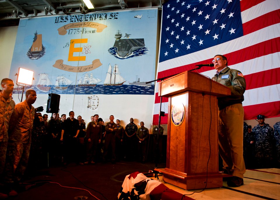 US Navy 120121-N-FI736-318 Secretary of Defense Leon E. Panetta speaks to Sailors and Marines in the hangar bay of the aircraft carrier USS Enterpr
