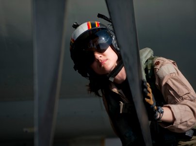 US Navy 120125-N-DR144-220 Plane Commander Lt. Cmdr. Tara Refo, assigned to Carrier Airborne Early Warning Squadron (VAW) 125, inspects the aircraf photo