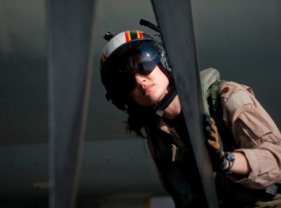 US Navy 120125-N-DR144-220 Plane Commander Lt. Cmdr. Tara Refo, assigned to Carrier Airborne Early Warning Squadron (VAW) 125, inspects the aircraf