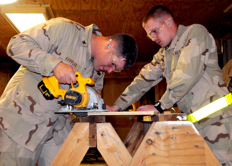 US Navy 120122-N-SD610-005 Builder 3rd Class Jerry Keppler, from Decatur, Ill., assigned to Naval Mobile Construction Battalion (NMCB) 7, uses a sk