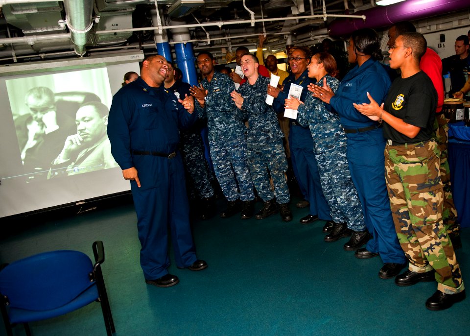 US Navy 120123-N-FI736-165 Sailors sing hymns during a Dr. Martin Luther King, Jr. birthday celebration aboard the aircraft carrier USS Enterprise