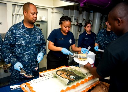 US Navy 120123-N-FI736-180 Sailors serve cake during a Dr. Martin Luther King, Jr. birthday celebration aboard the aircraft carrier USS Enterprise photo