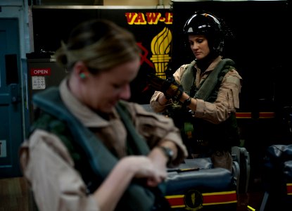 US Navy 120125-N-DR144-094 Pilot Lt. Ashley Ruic, left, and Plane Commander Lt. Cmdr. Tara Refo, both assigned to Carrier Airborne Early Warning Sq
