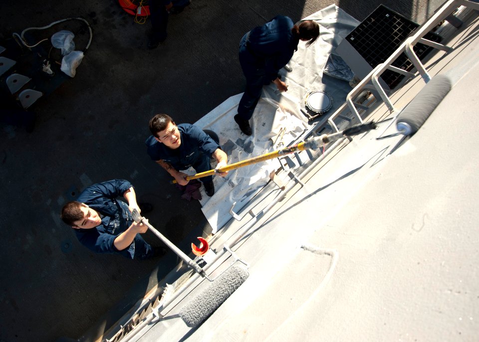 US Navy 120128-N-NL401-006 Sailors aboard the Arleigh Burke-class guided-missile destroyer USS James E. Williams (DDG 95) paint the exterior bulkhe