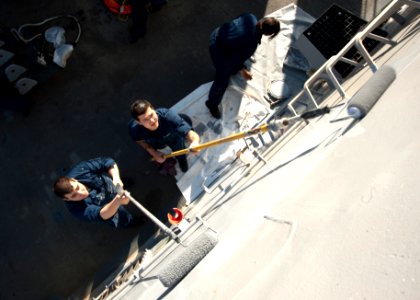 US Navy 120128-N-NL401-006 Sailors aboard the Arleigh Burke-class guided-missile destroyer USS James E. Williams (DDG 95) paint the exterior bulkhe