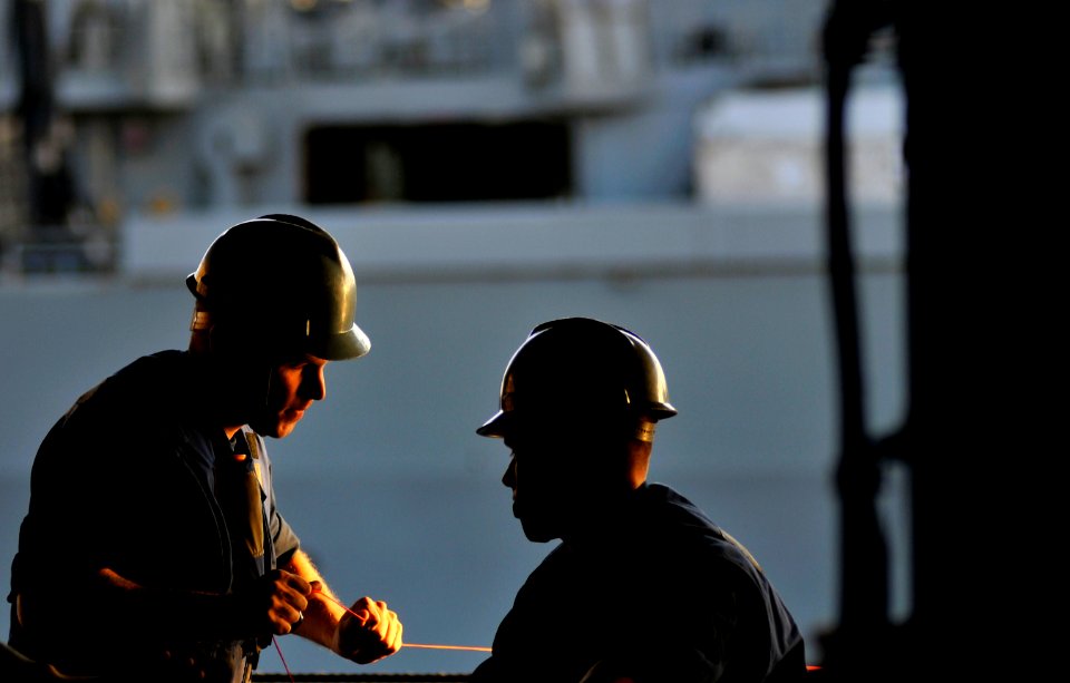 US Navy 120125-N-ZI635-090 Sailors pull in the messenger line in the hangar bay aboard the Nimitz-class aircraft carrier USS Carl Vinson (CVN 70) d