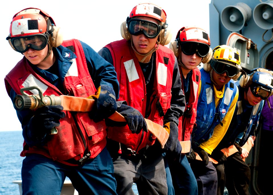 US Navy 120124-N-OH194-004 Members of the flight deck firefighting team conduct drills on the flight deck of the guided missile destroyer USS Wayne