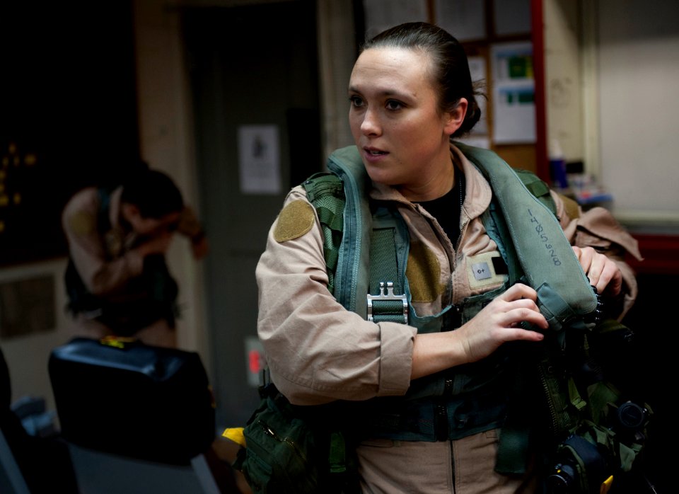 US Navy 120125-N-DR144-082 Radar Operator Lt. j.g. Ashley Ellison, assigned to Carrier Airborne Early Warning Squadron (VAW) 125, dresses out in th