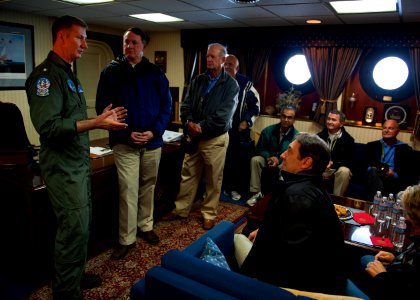 US Navy 120128-N-FI736-141 Rear Adm. Walter E. Carter, commander of Carrier Strike Group (CSG) 12, speaks to visitors during a tour aboard the airc photo