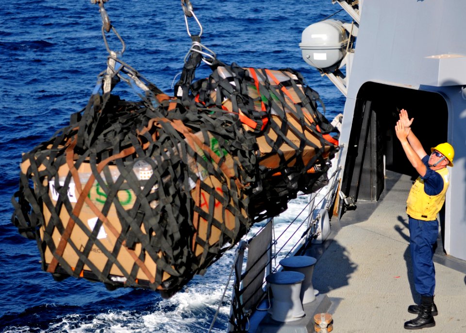 US Navy 120127-N-ZF681-080 Boatswain's Mate 2nd Class Michael Ringleman manages supplies aboard the guided-missile destroyer USS Halsey (DDG 97) du