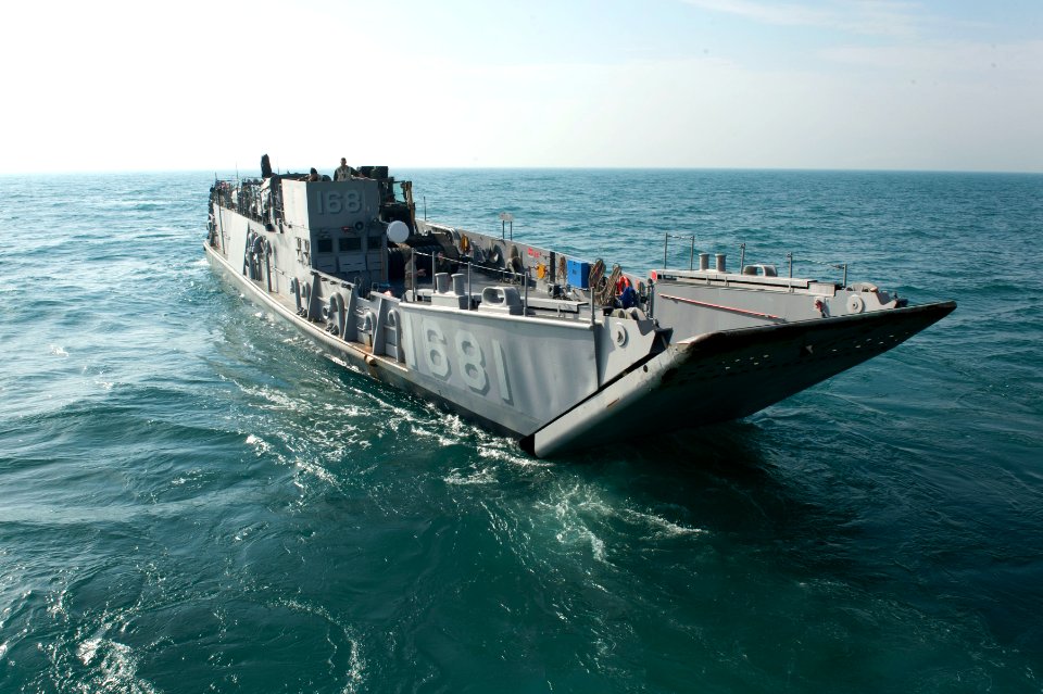 US Navy 120127-N-KS651-157 A landing craft utility departs the welldeck of the amphibious dock landing ship USS Pearl Harbor (LSD 52) during wellde