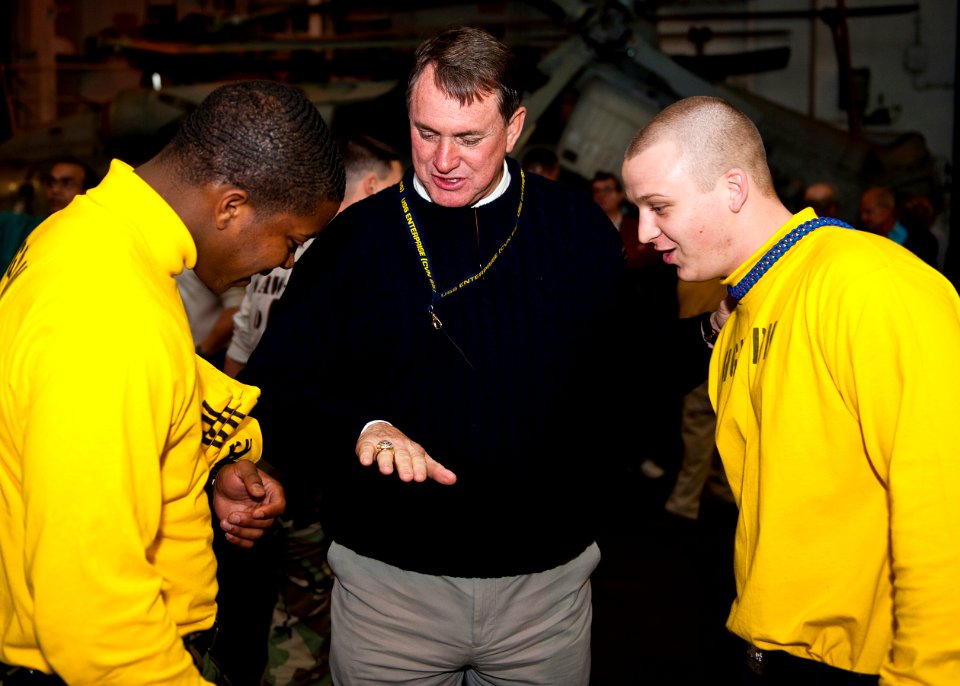 US Navy 120128-N-FI736-787 Butch Davis, a former NFL coach, and current head football coach at the University of North Carolina, shows Sailors his