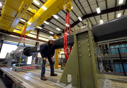 US Navy 120130-N-PO203-051 A government worker makes final checks prior to maneuvering the 32-MJ version of the Office of Naval Research-funded Ele