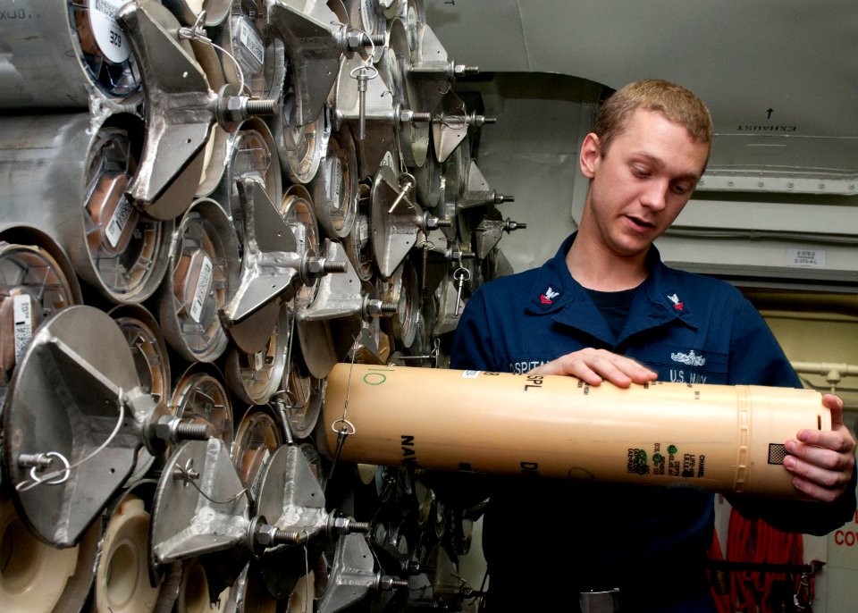 US Navy 120125-N-ZZ999-036 Sonar Technician 2nd Class Paul Ospital inventories sonabouys aboard the guided missile destroyer USS Wayne E. Meyer (DD