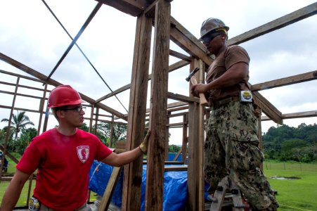 US Navy Seabees and US Air Force RED HORSE engineers build a school in Papua New Guinea during Pacific Partnership 150703-N-UQ938-010