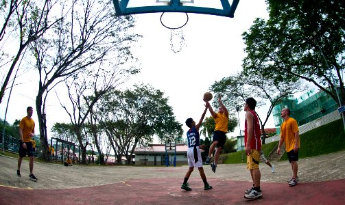 US Navy 120127-N-OY799-094 Sailors assigned to the Nimitz-class aircraft carrier USS John C. Stennis (CVN 74) play basketball with boys and staff m